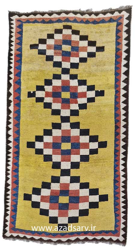 Figure 26.Although the gabbeh rugs of Persia show stmple designs, small structural features at times allow them to be identified as to tribal source. This was woven by the Bakhtiari, although it contains no specific tribal features. Approx. 108 x 56kins. (274 x 144cm) azadsarv carpet فرش دستباف آزادسرو