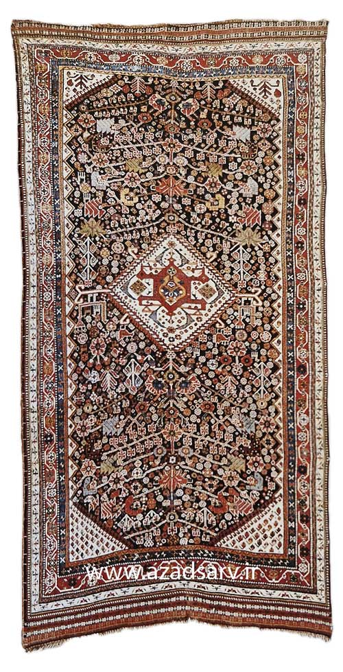 Figure 29. Qashqa'i rug with a characteristic small medallion and a blue field with a variety of repeating figures. Assigning a Qashqai rug to a specific subtribe is based more upon the fineness of weave than upon the design elements, which are shared among the various groups.azadsarv carpet فرش دستباف آزادسرو 