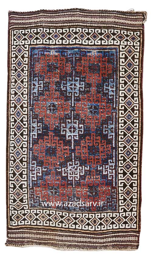 Figure 38. Balwuchi-type rug made by the Taimani of Afghanistan. The Taimani are not a Baluchi tribe, but have been weaving rugs in the same dark tones and simple geometric designs. Taimani rugs, however, are less likely to show flatwoven stripes with designs at both ends. azadsarv carpet فرش دستباف آزادسرو